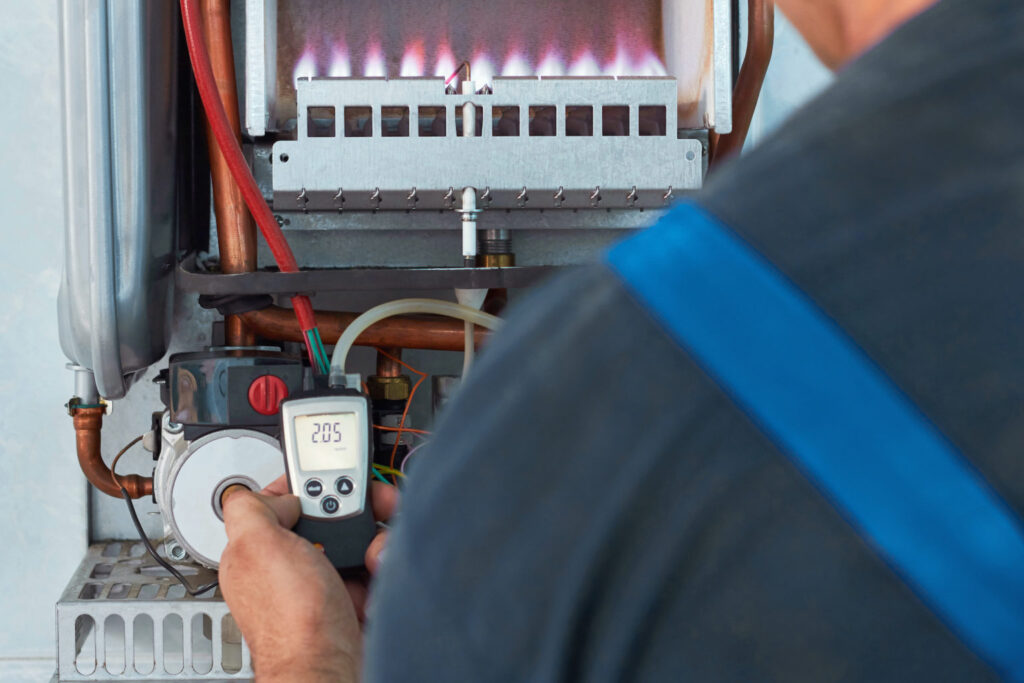 Faszold technician working on a gas boiler