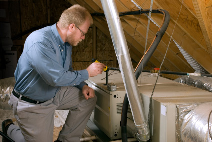 HVAC technician repairing indoor unit